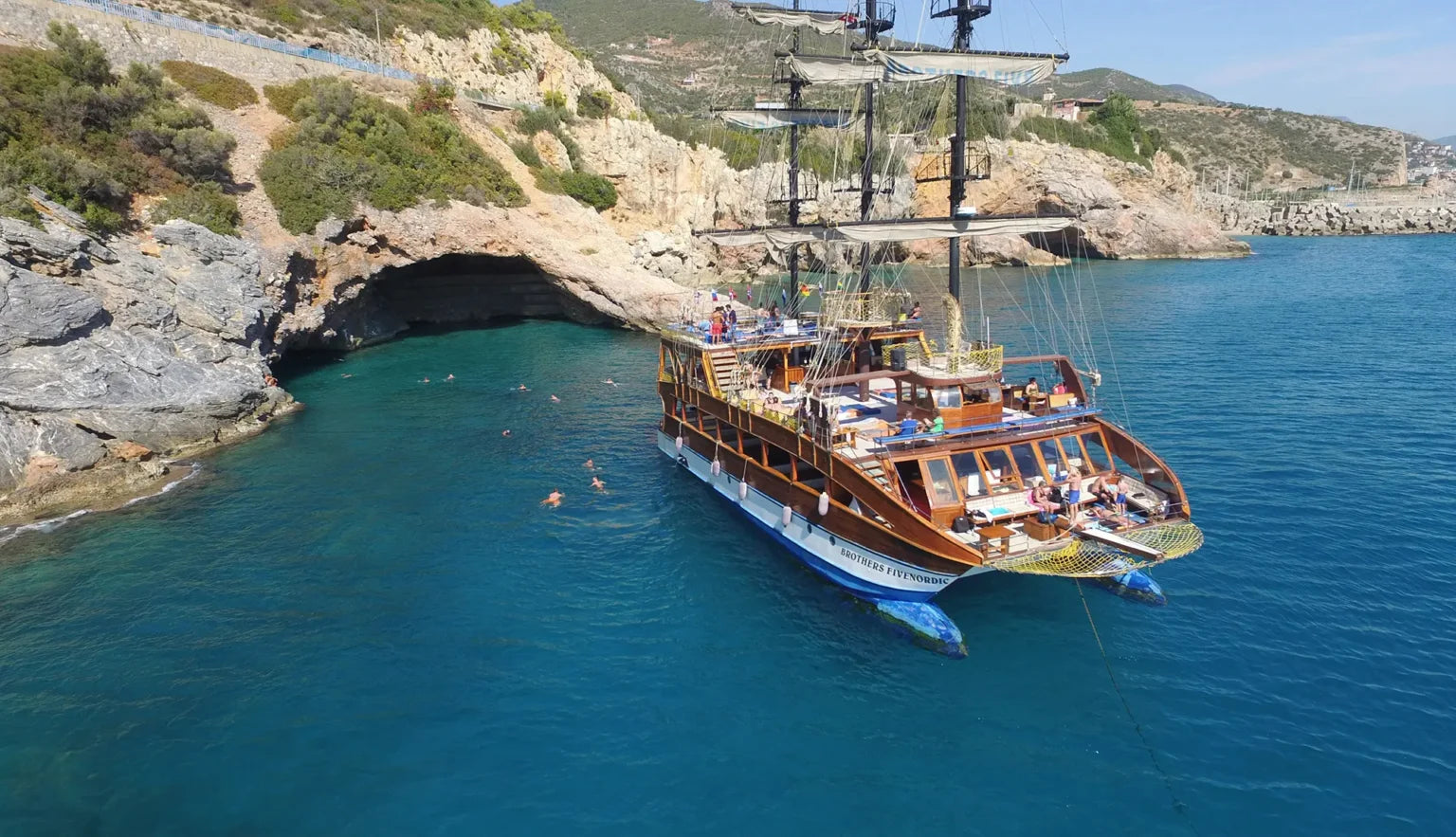 Alanya Catamaran Boat Tour with swimming breaks, music, sea views and Mediterranean coastline