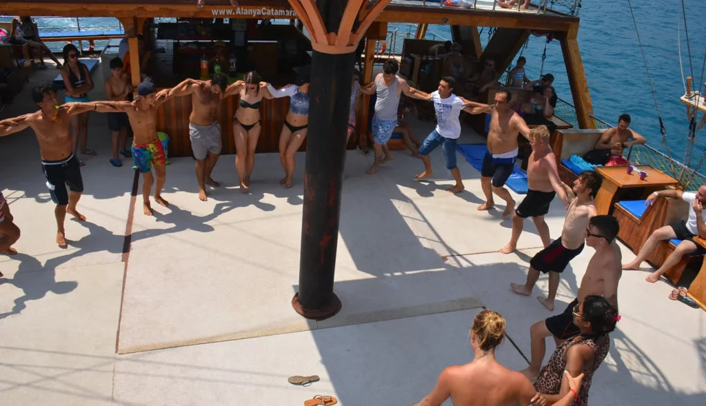 Alanya Catamaran Boat Tour with swimming breaks, music, sea views and Mediterranean coastline