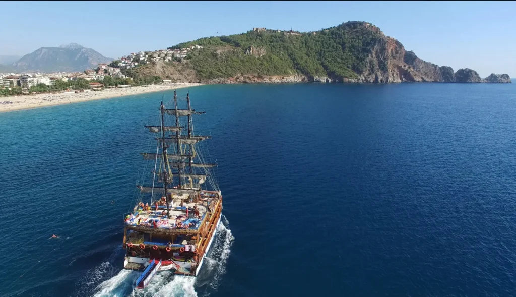 Alanya Catamaran Boat Tour with swimming breaks, music, sea views and Mediterranean coastline