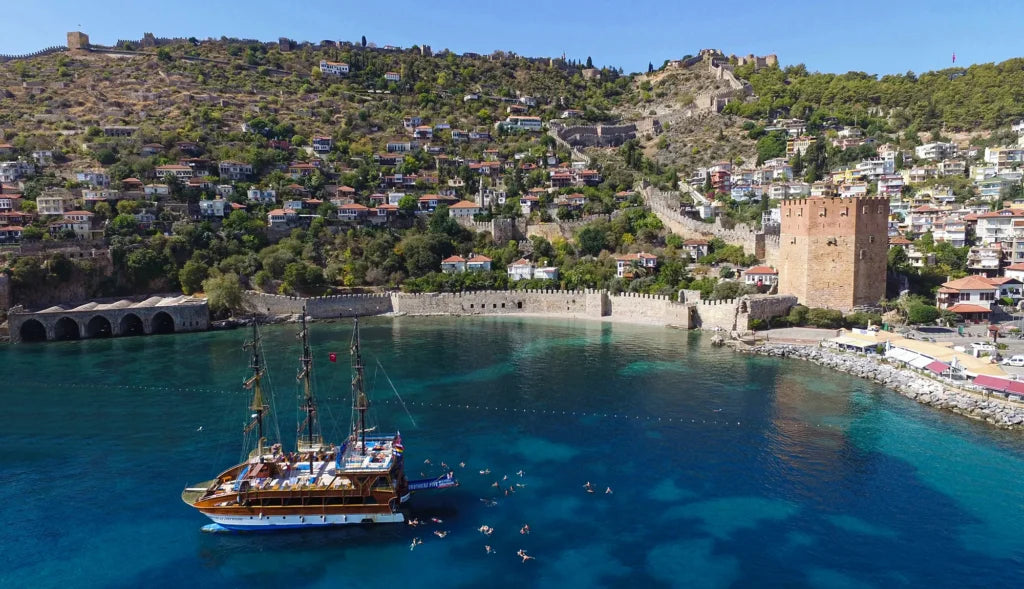 Alanya Catamaran Boat Tour with swimming breaks, music, sea views and Mediterranean coastline